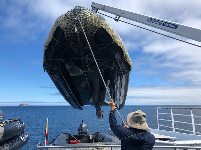 Loading a Zodiac onto the ship